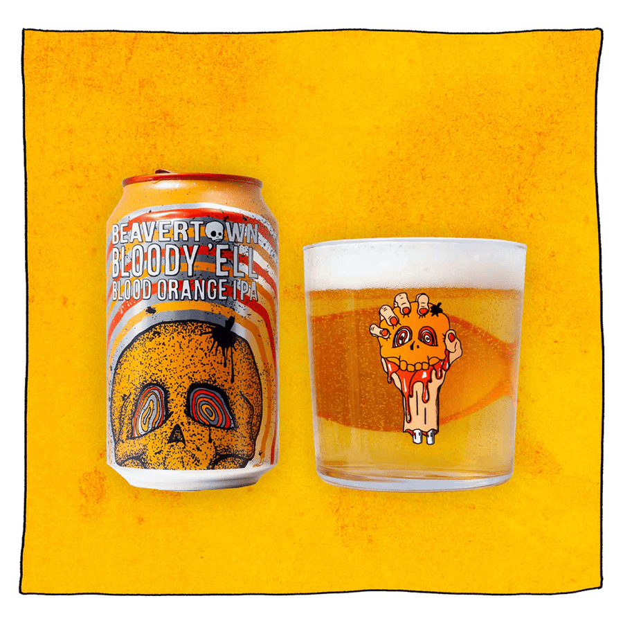 Beavertown Brewery Bloody E'll Blood Orange IPA Can and Beavertown Half pint glass filled with beer in front of a grey background. Beer glass is clear glass but contains an image of a bloody severed arm with orange fingernails clenching a small orange skull.