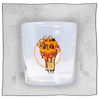 Beavertown Blood E'll Half pint glass. Blood E'll half pint glass is empty and contains a logo of a bloody severed arm with orange fingernails clenching a small orange skull. Grey background.