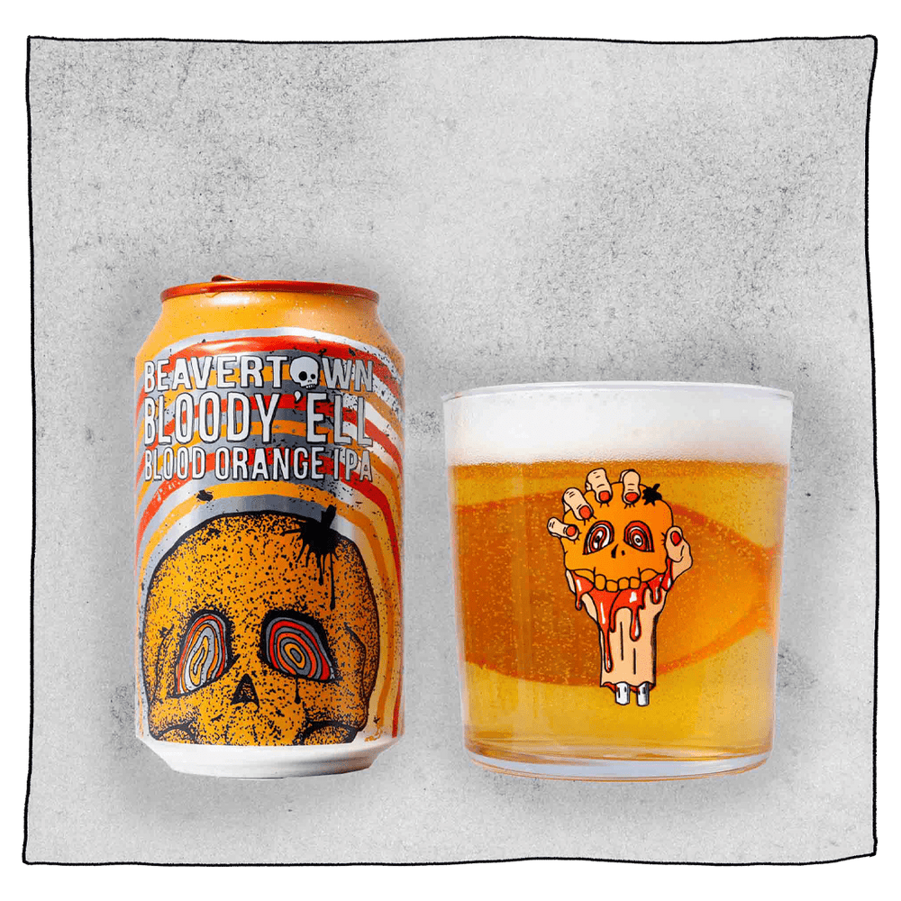 Beavertown Brewery Bloody E'll Blood Orange IPA Can and Beavertown Half pint glass filled with beer in front of a grey background. Beer glass is clear glass but contains an image of a bloody severed arm with orange fingernails clenching a small orange skull.