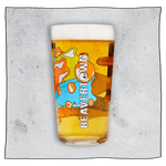Beavertown Bones Pint Glass. Side profile of glass with beer with orange and blue streaks and white Beavertown logo. Grey background.