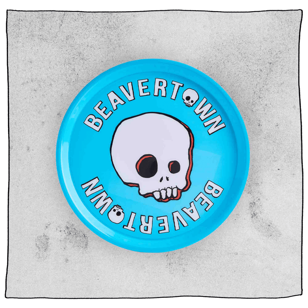 Beavertown Brewery circle drinks tray in blue plastic. Tray has the words Beavertown around the sides with a skull in the centre.