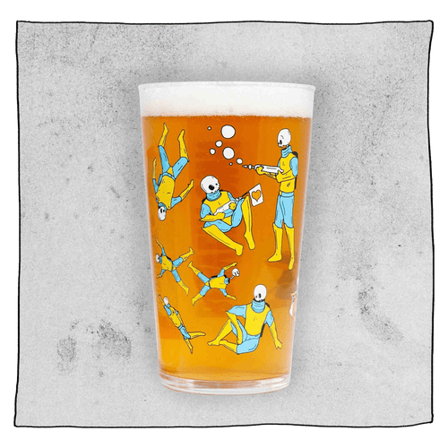 Beavertown Gamma Ray Pint Glass. Glass filled with beer and has many Gamma Ray men scattered around the glass. Grey background.