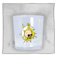 Beavertown Gamma Ray Tumbler glass in front of a light grey background. Beer glass is clear glass that has a salmon pink skull inside a white space helmet with yellow flashes.