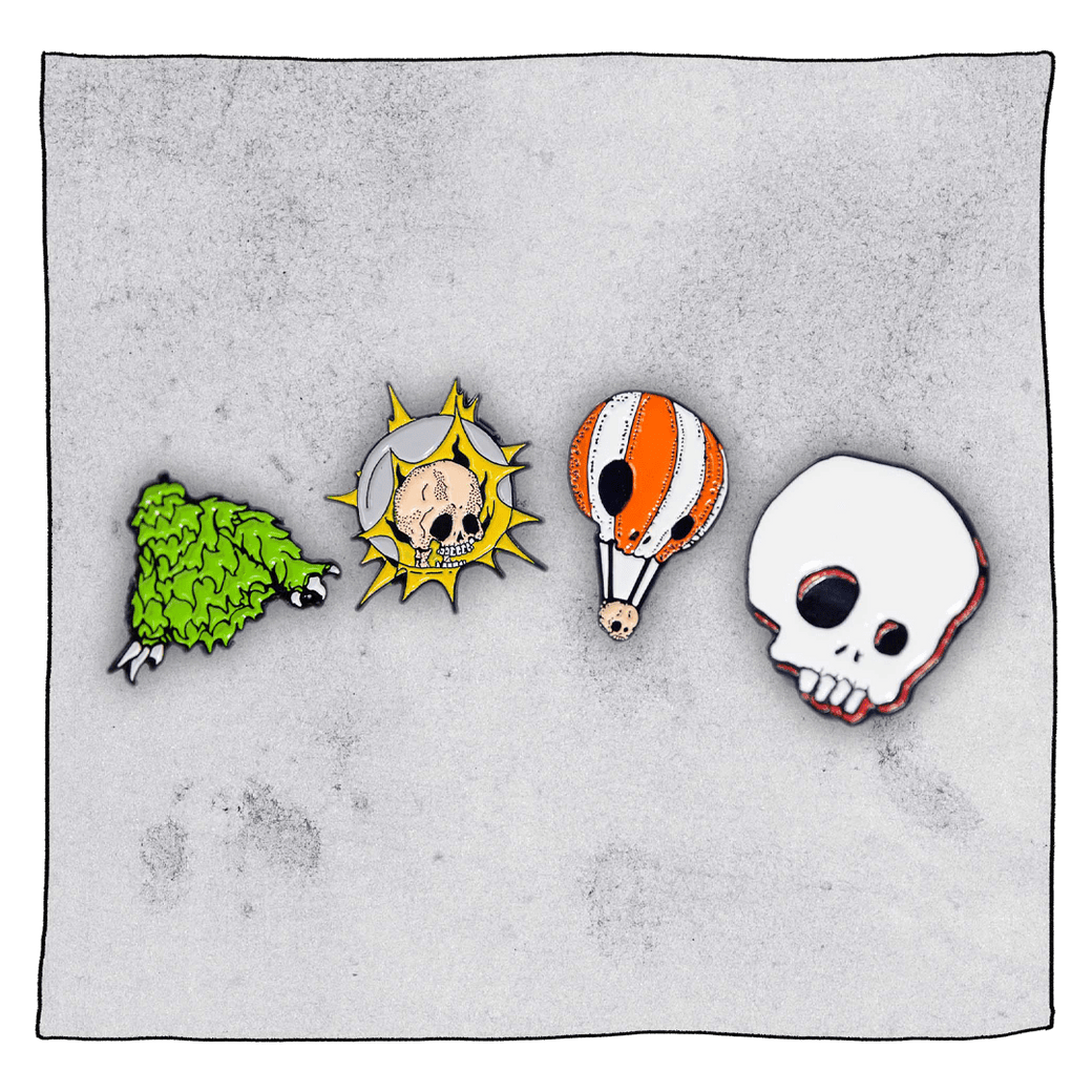 Lupuloid, Gamma Ray, Neck Oil and white Beavertown skull pin badges in front a grey background.