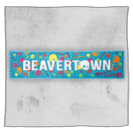 Beavertown Pschedelic Blue Bar runner in front of a grey background. Bar runner has white Beavertown text and colourful skulls and bones.