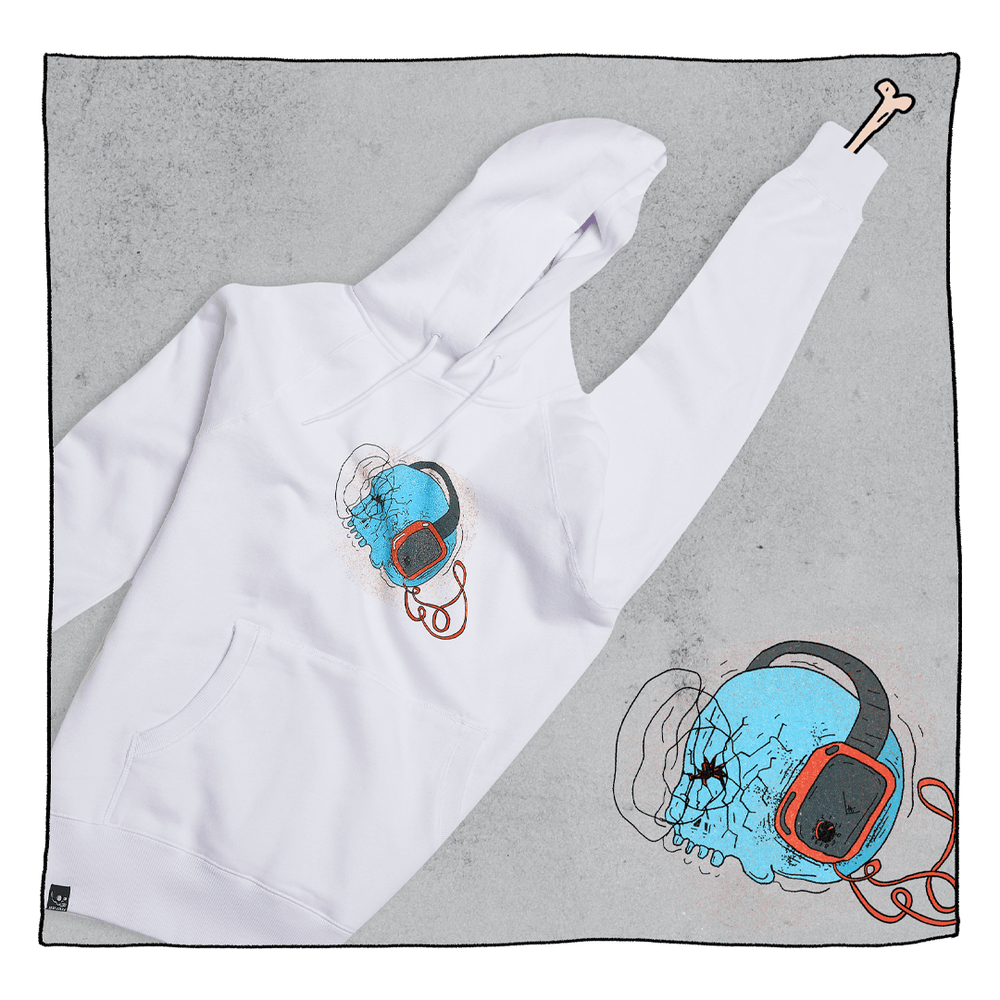 Skeletunes Hoodie in White in front of a grey back ground. Hoodie has a blue skull wearing black and red headphones. This illustration is also in the background.