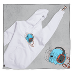 Skeletunes Hoodie in White in front of a grey back ground. Hoodie has a blue skull wearing black and red headphones. This illustration is also in the background.
